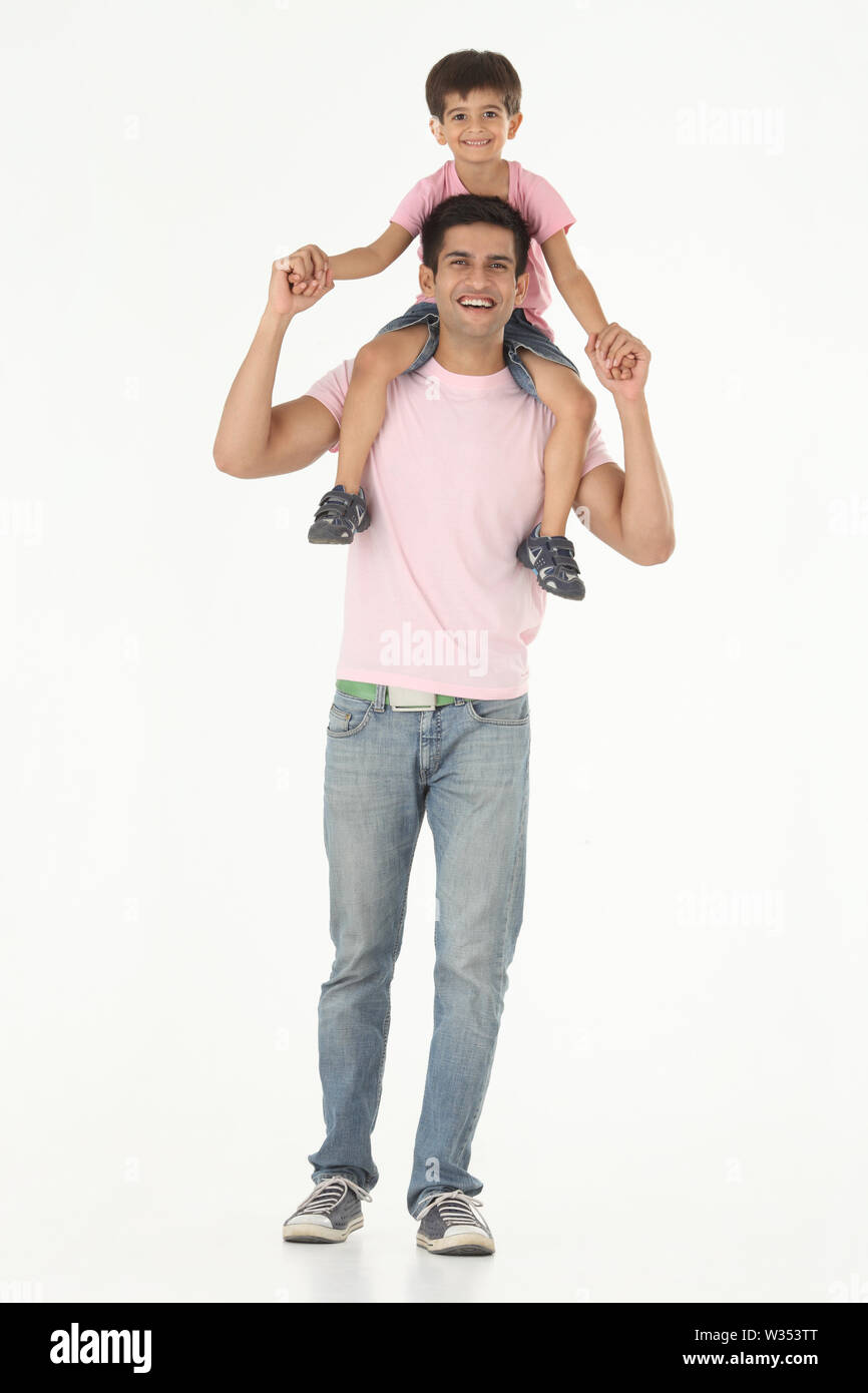 Man Carrying His Son On Shoulders Stock Photo Alamy