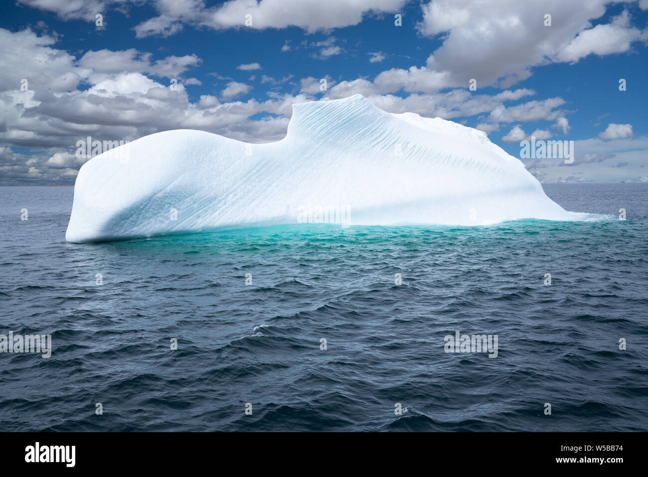 Iceberg Floating In The Ocean Off The Coast Of Newfoundland Canada