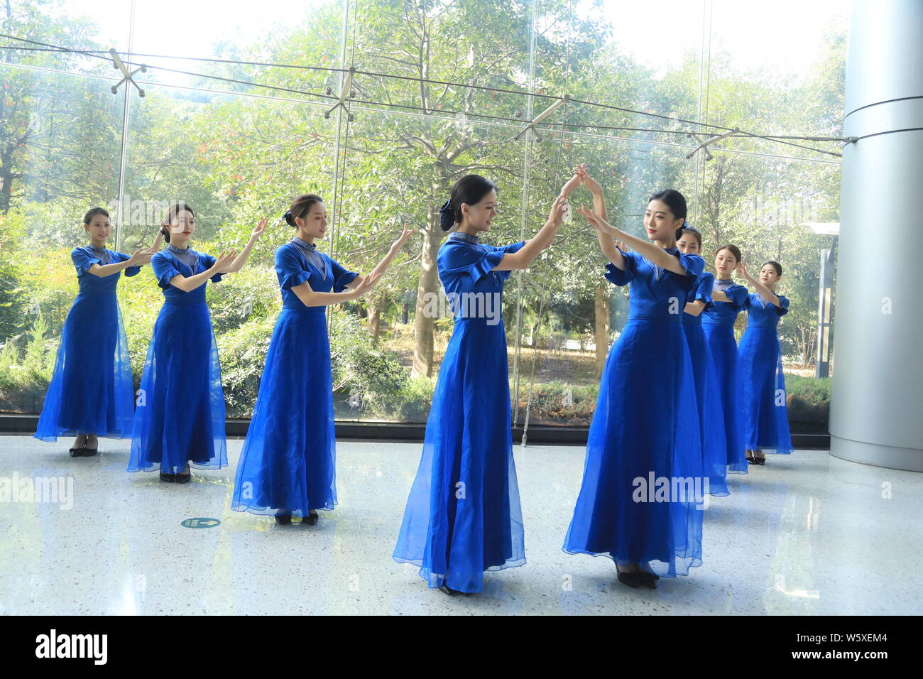 Chinese Volunteers Wearing Cheongsam Qipao Pose For Photos Ahead Of