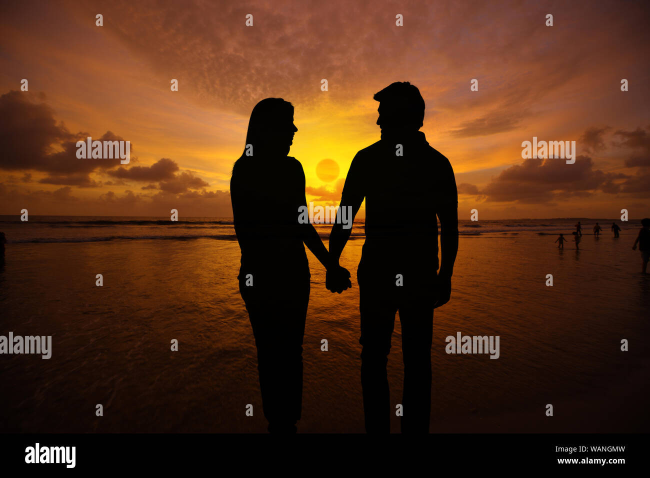 Silhouette Of Couple Holding Hands On The Beach Stock Photo Alamy