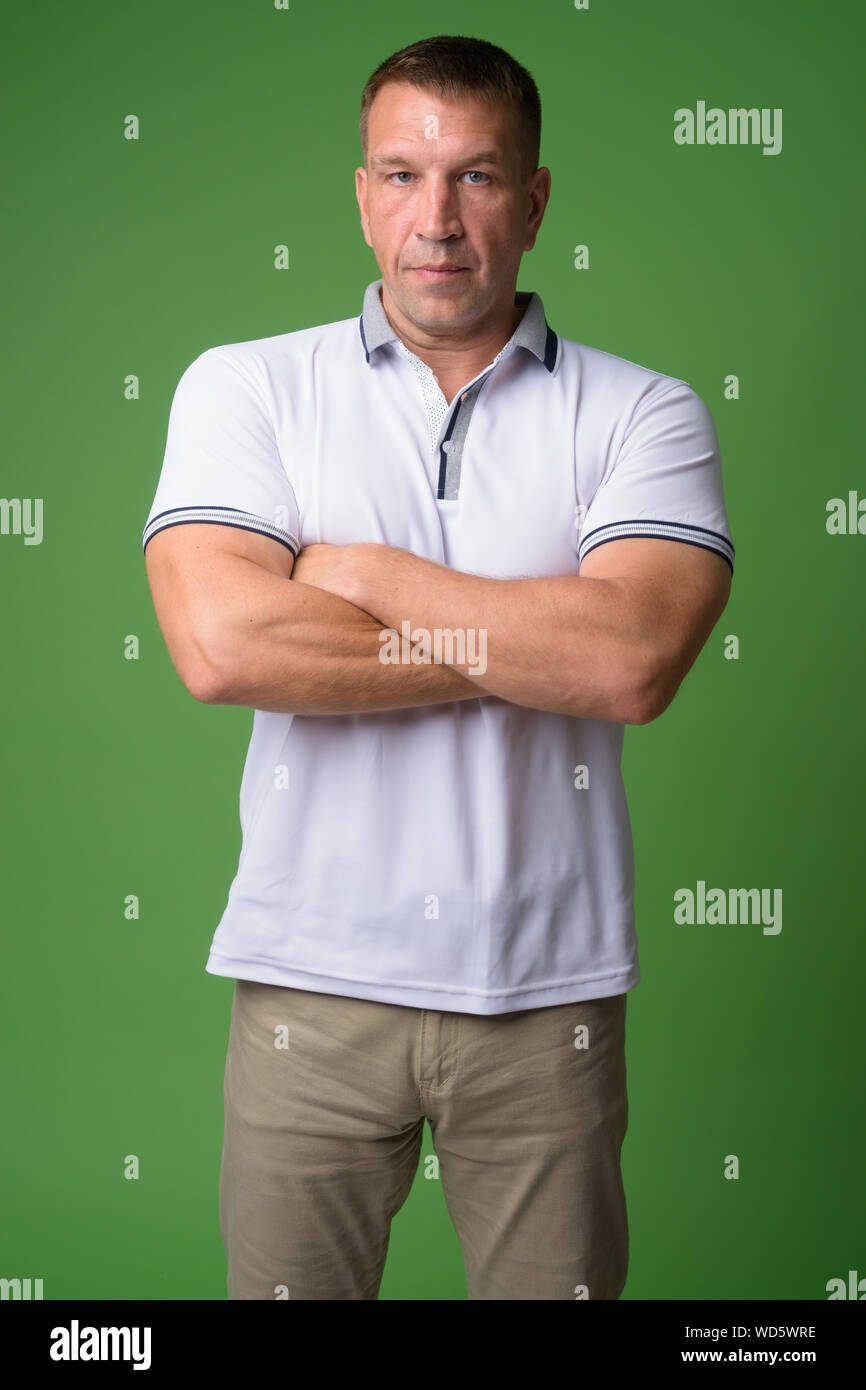 Portrait Of Macho Mature Man With Arms Crossed Stock Photo Alamy