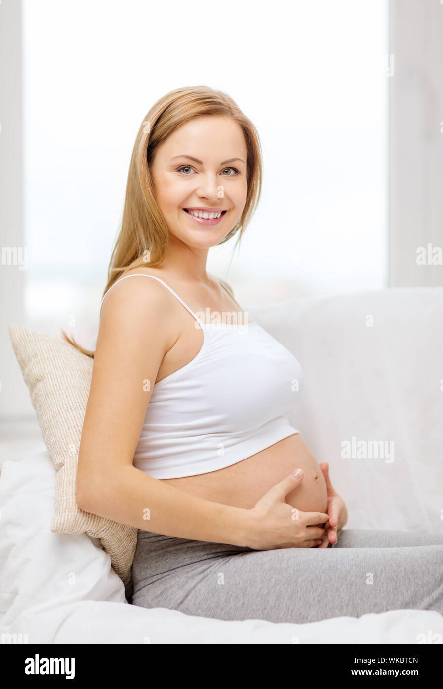 Happy Pregnant Woman Touching Her Belly Stock Photo Alamy