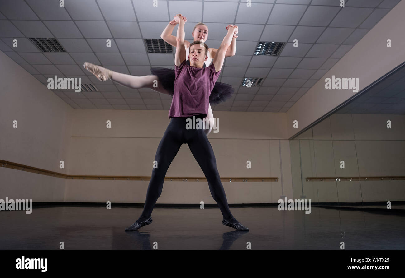 Ballet Partners Dancing Gracefully Together In The Ballet Studio Stock