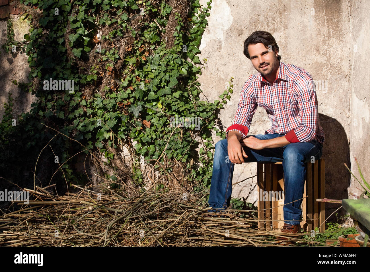 Male Model Sitting Legs Crossed High Resolution Stock Photography And