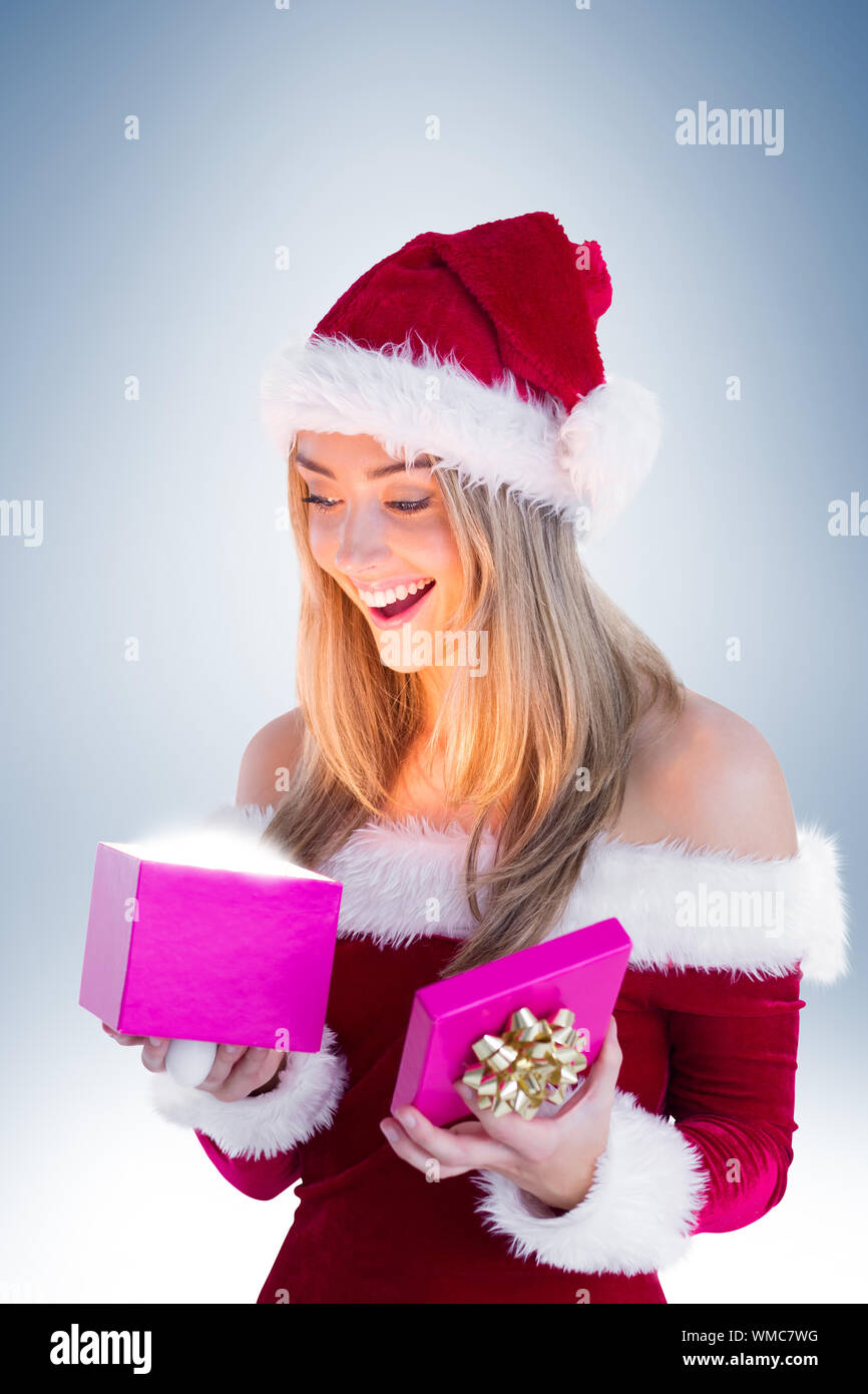 Festive Blonde Opening A Gift On Vignette Background Stock Photo Alamy