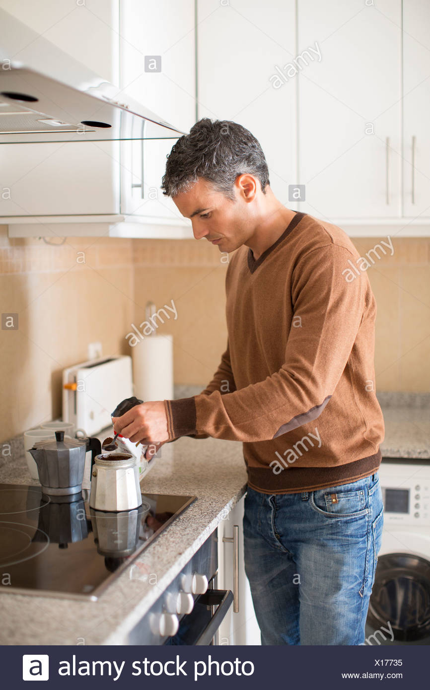 Man Making Coffee In Kitchen Man Making Coffee In Kitchen
