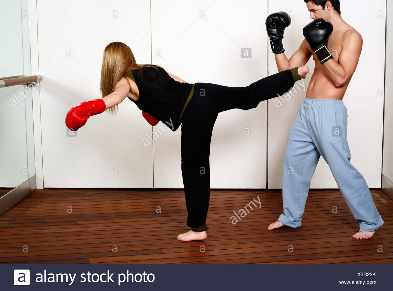 straight right hand punch of active tae bo and side kick stock photo