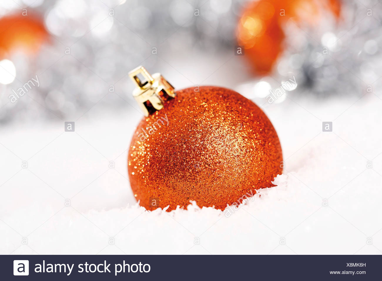 Orange Glitter Christmas Tree Balls On Snow With Decorations Orange Glitter Christmas Tree Balls On Snow With Decorations