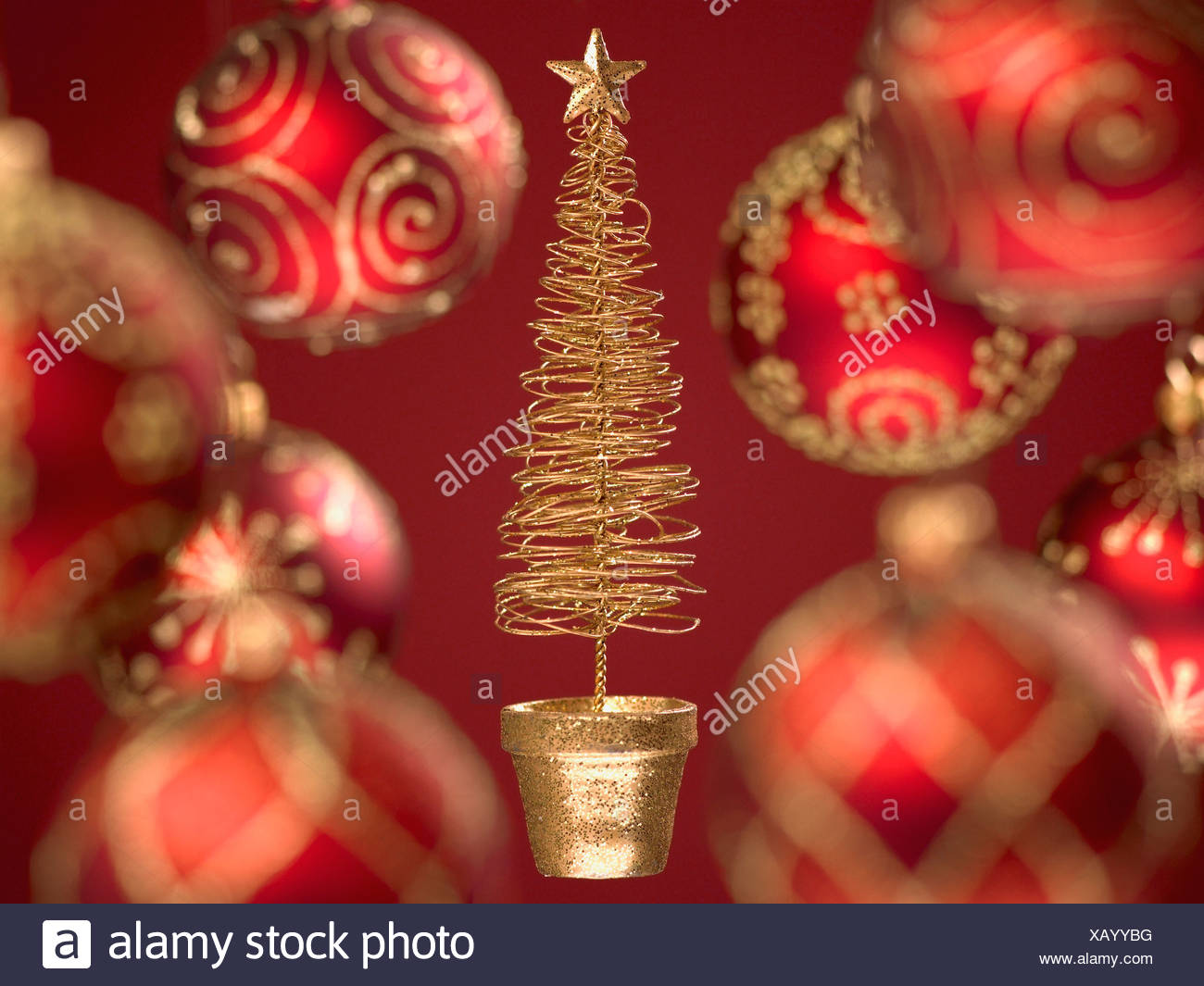 Close Up Of Red Christmas Ornaments And Small Tree Close Up Of Red Christmas Ornaments And Small Tree