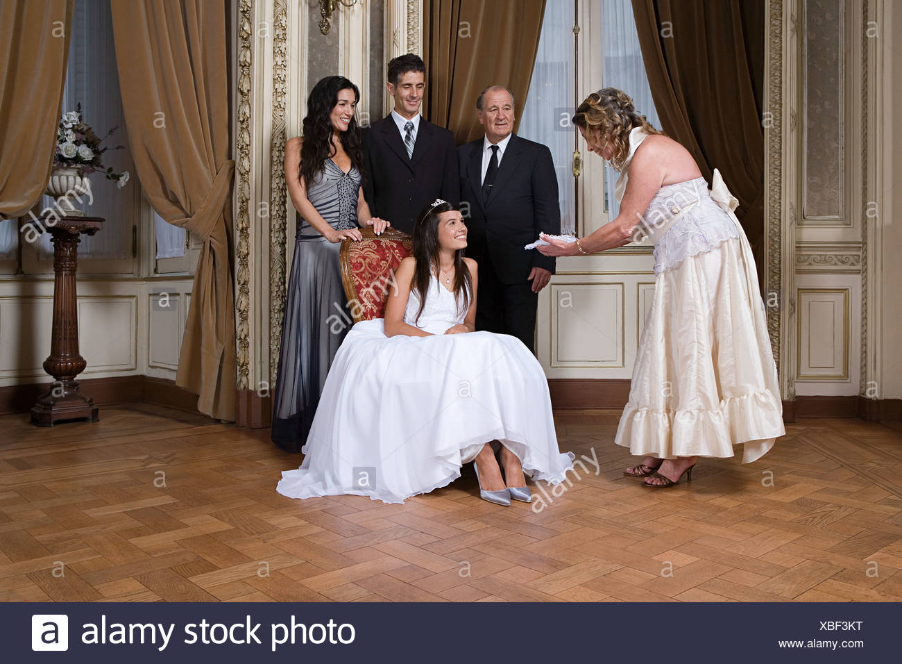 grandmother giving quinceanera gift to girl stock photo 282459292