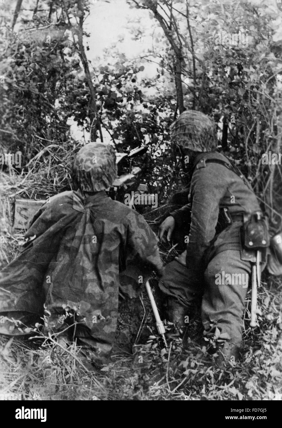 Stahlgewitter Ruhm Und Ehre Der Waffen Ss Maschinengewehr Stellung der Waffen-SS in der Normandie 1944 Stockfoto