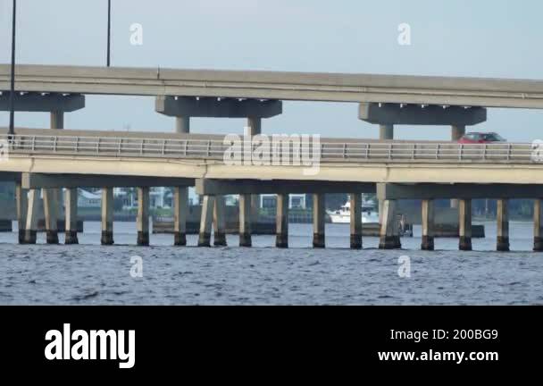 Cars driving on bridge over Charlotte Harbor bay in Florida ...