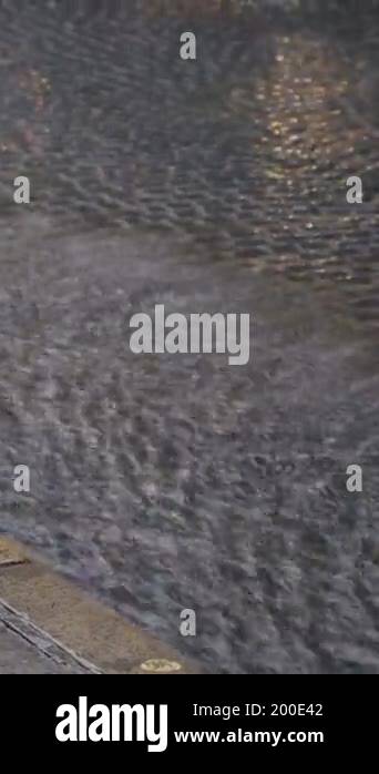 Turning Back Raining rain drops are turning into a stream of water which flowing on the ...