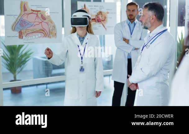Multi-cultural medical staff testing VR technologies wearing headset on ...