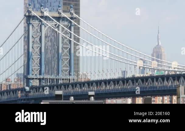 New York City Manhattan Bridge From Brooklyn Bridge View Empire State Building In Midtown USA