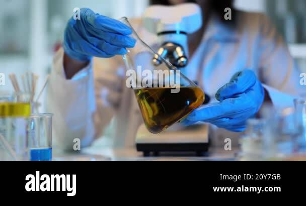Laboratory experiment demonstrating chemical reactions and oil analysis ...
