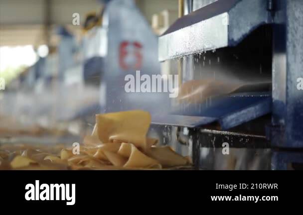 The close up view of the natural rubber sheet cleansing process by the ...