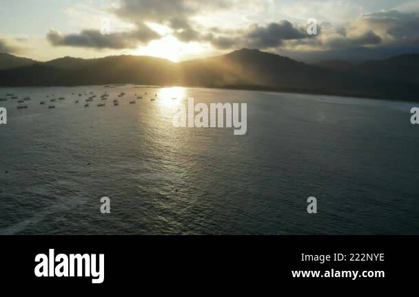 Several boats in the ocean on the coast of the island of Java, standing ...