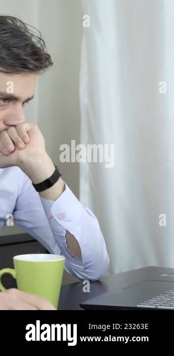 Overtime view of young man working in home office remotely, work ...