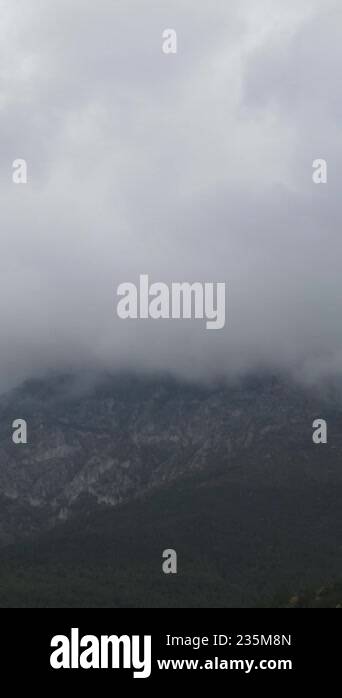 Mist Weather Condition Drone view of dense fog cloud on top of high mountains, mist cloud in ...