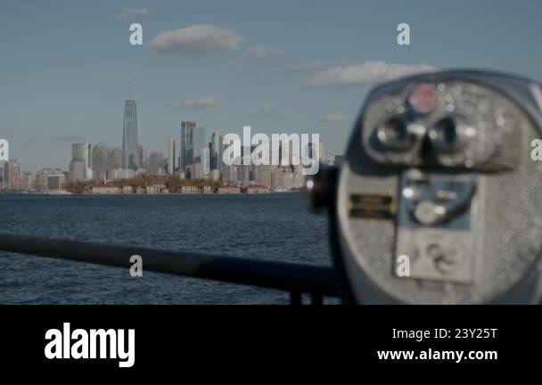 A coinoperated viewing machine offering a breathtaking skyline backdrop ...