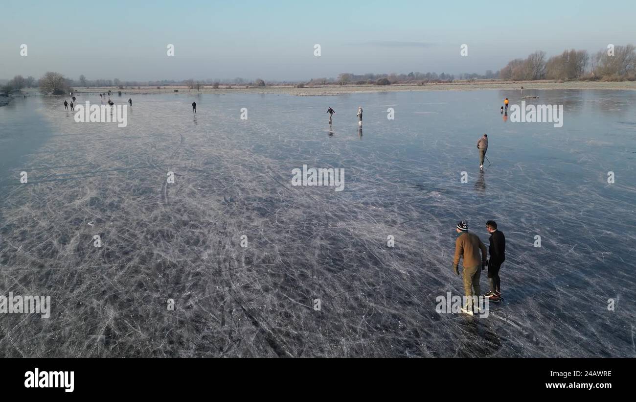 Drone footage shows ice skaters on a frozen flooded field in ...