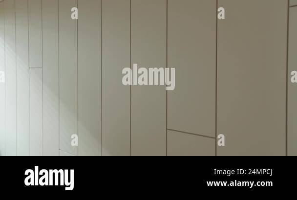 Minimalist White Wall Panels with Elegant Shadow Play. A clean and ...