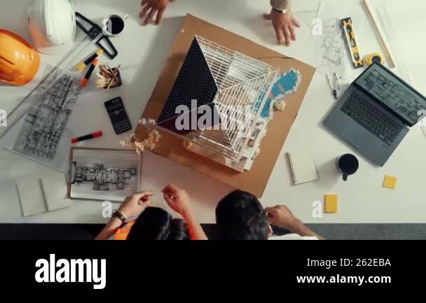 Time lapse of smart engineer team measure house model by using pencil ...