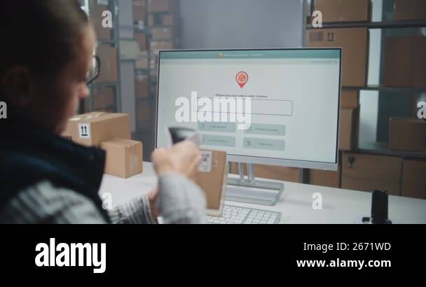 Female Postal Warehouse Employee Scans Code on Cardboard Box with ...