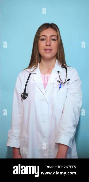 Vertical Professional Female Physician Wearing White Lab Coat And vertical-professional-female-physician-wearing-white-lab-coat-and