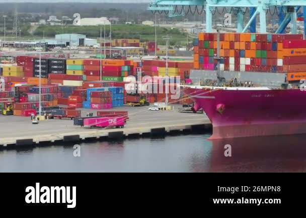 Cargo container yard in sea port in Savannah, Georgia. Crane unloading ...