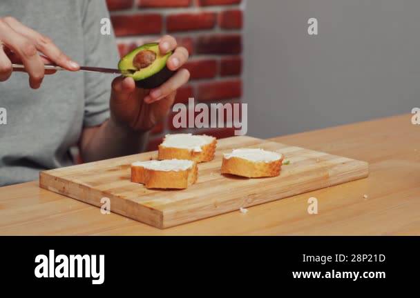 Home cooking daily routine. Man preparing lunch. Man sitting at table ...