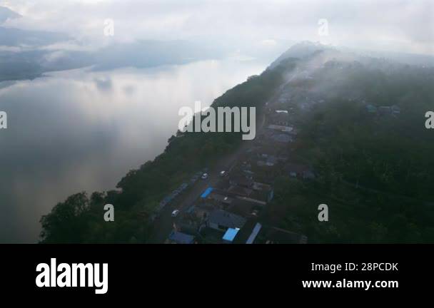 Aerial view of Danau Buyan volcanic Lake in Bali among mountains and ...