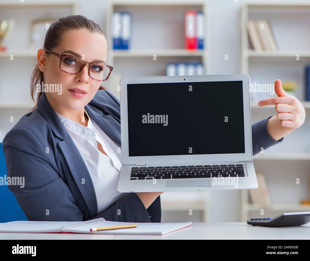 The businesswoman working in the office at desk Stock Photo - Alamy