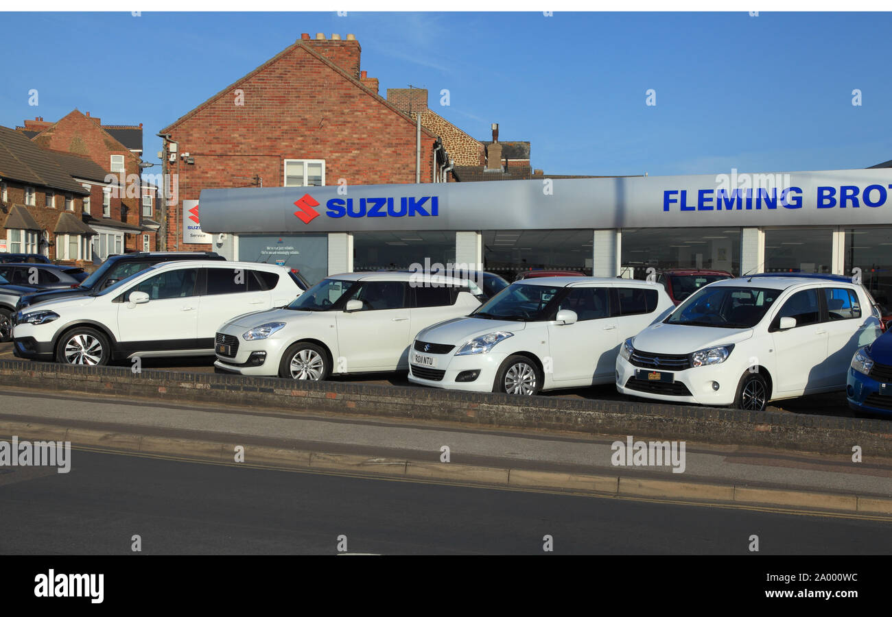 White, Suzuki, motor cars, vehicles, sales, forecourt, Hunstanton, Norfolk, England Stock Photo