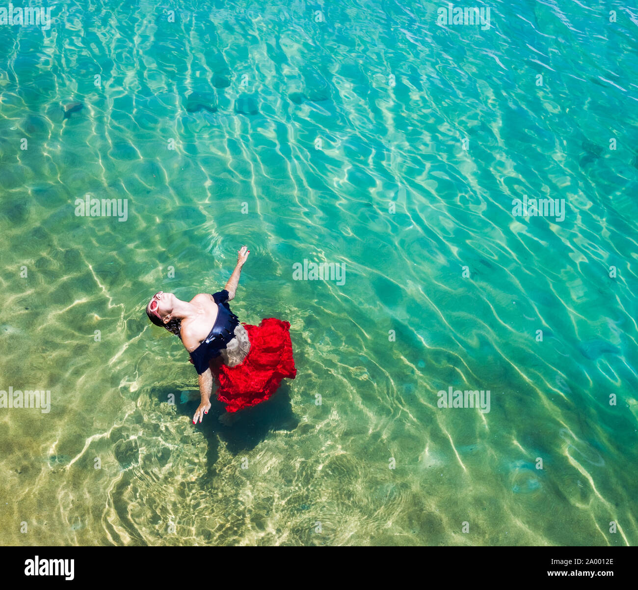 Beautiful woman dancing beach hi-res stock photography and images - Alamy