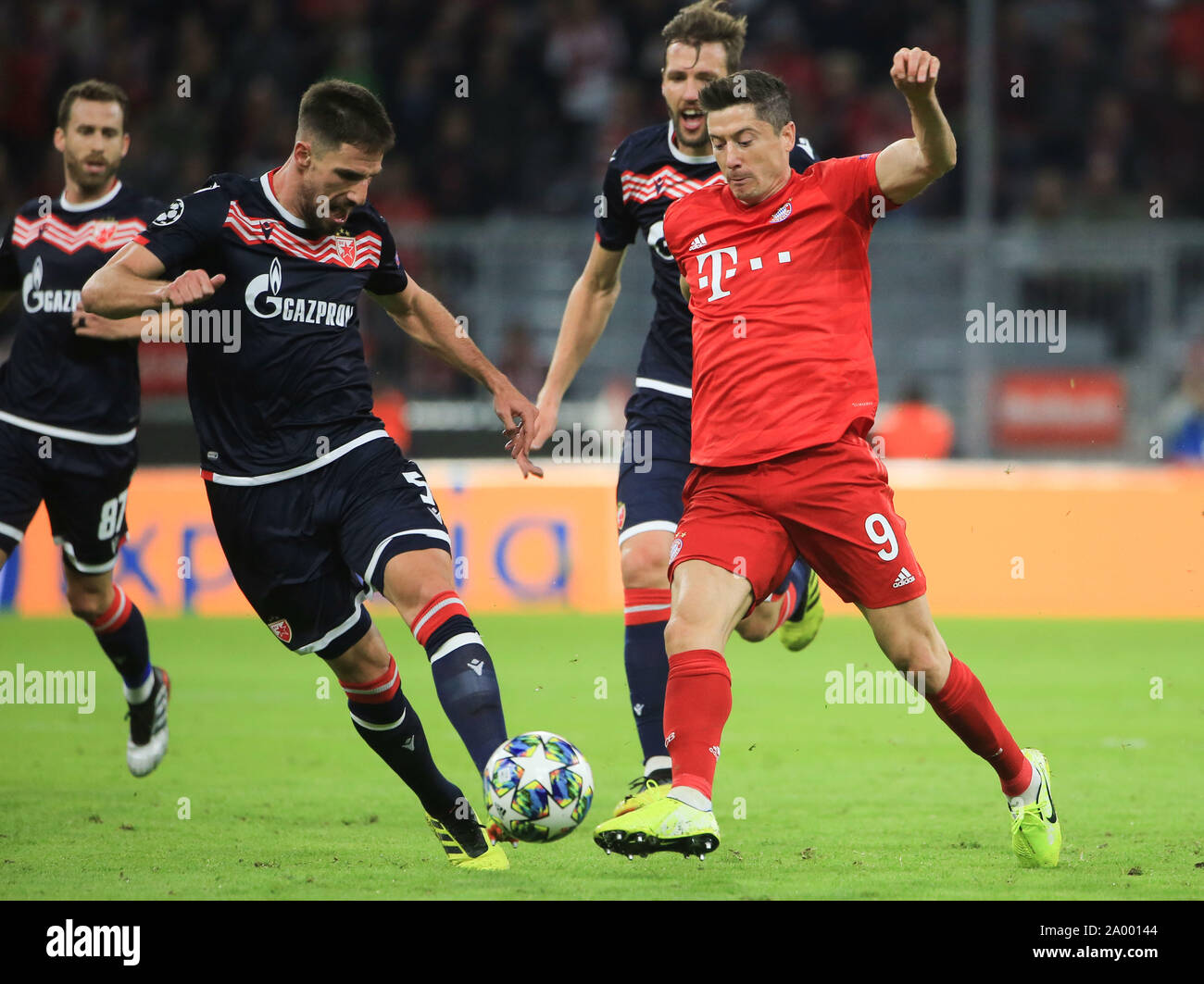 Munich, Germany. 18th Sep, 2019. Robert Lewandowski (1st R) of Bayern  Munich vies with Milos Degenek (2nd L) of Red Star Belgrad during the group  B match between FC Bayern Munich of