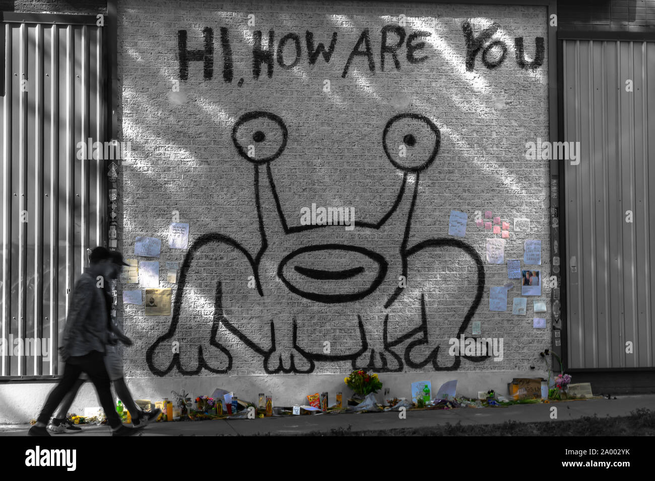 A makeshift memorial is formed under the iconic 'Hi How Are You' mural in Austin to celebrate the life of artist Daniel Johnston, who passed 9/11/19. Stock Photo