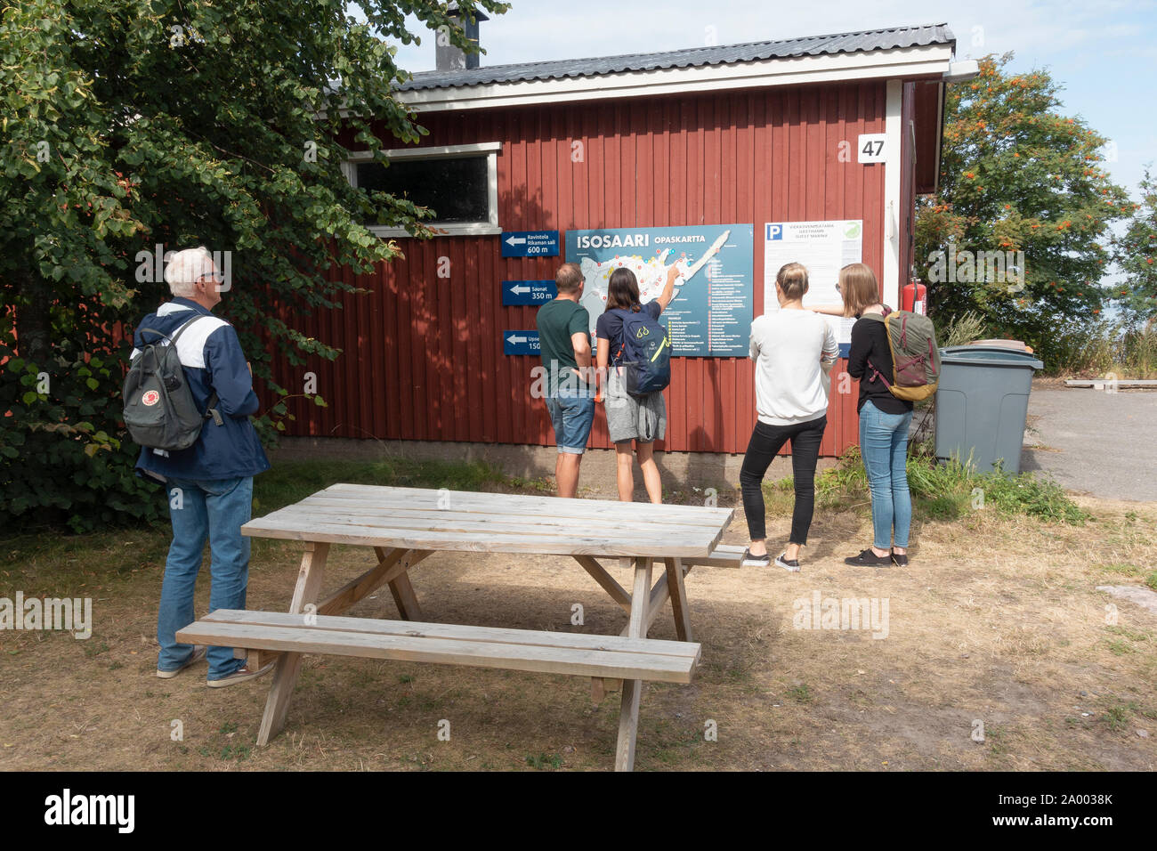 Tourists at Isosaari guide map on Isosaari island in Helsinki Finland Stock Photo