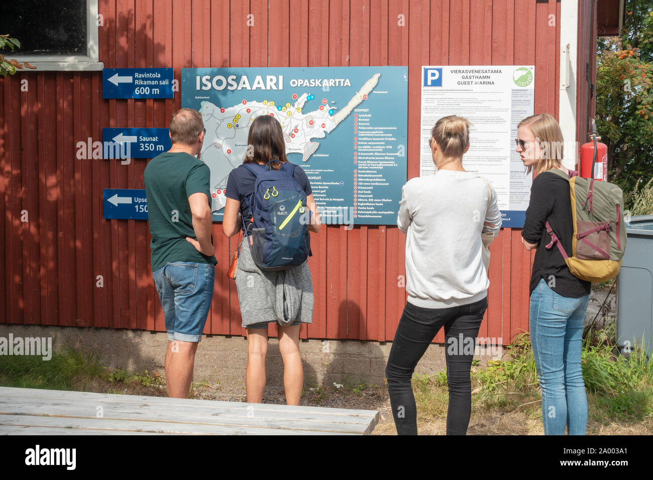 Tourists at Isosaari map on Isosaari island in Helsinki Finland Stock Photo