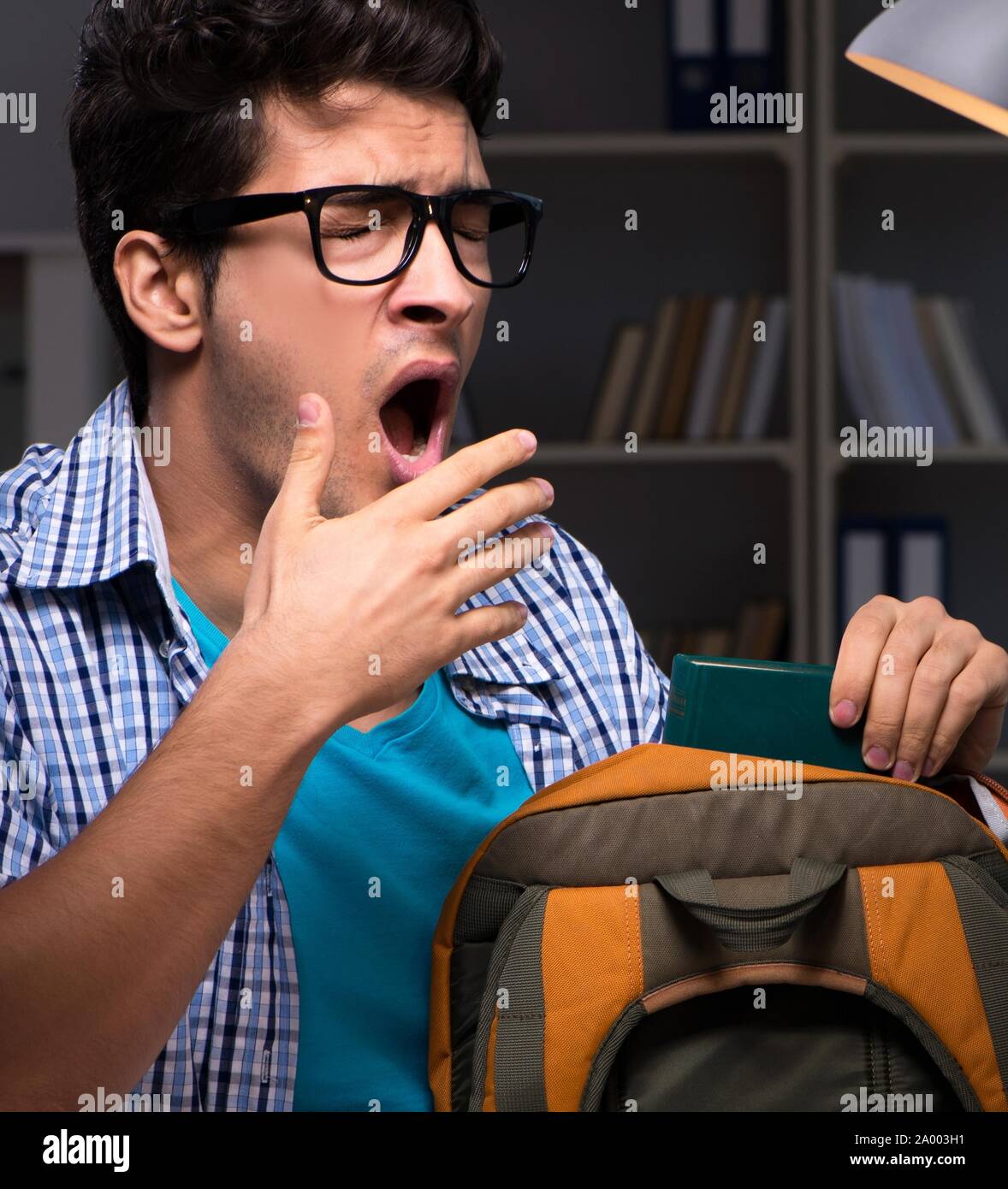 The student preparing for exams late night at home Stock Photo - Alamy
