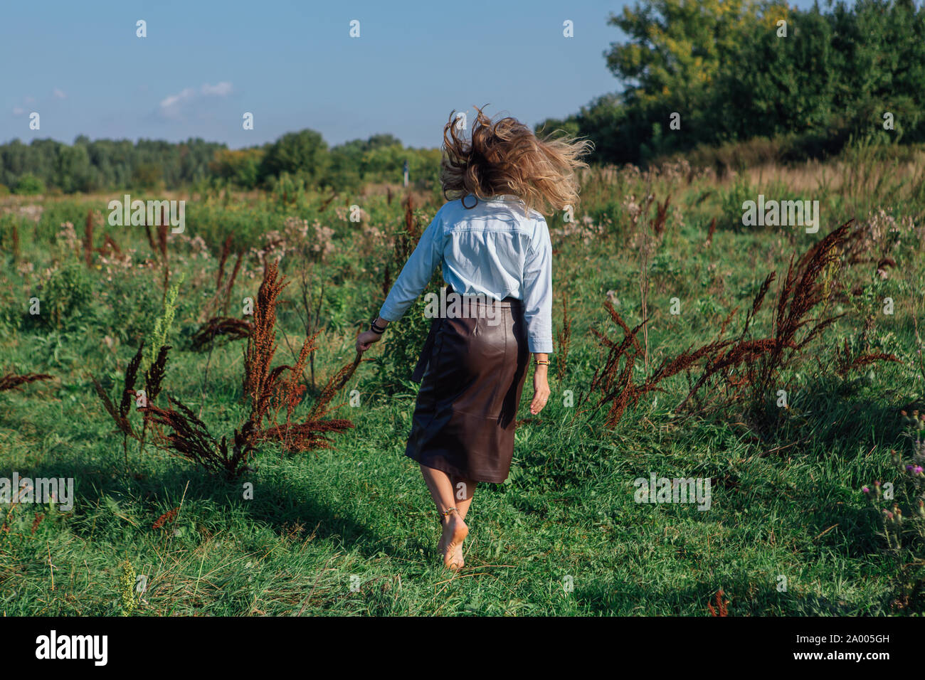 Boho woman walking away hi-res stock photography and images - Alamy