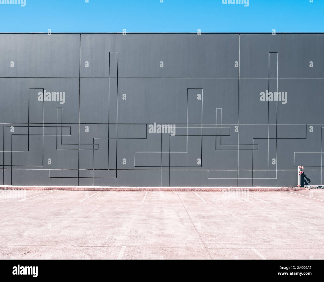 Curated visual reference: Unoccupied Warehouse Space Reference: Unoccupied Parking Lot Next To Warehouse Wall With Copy Space