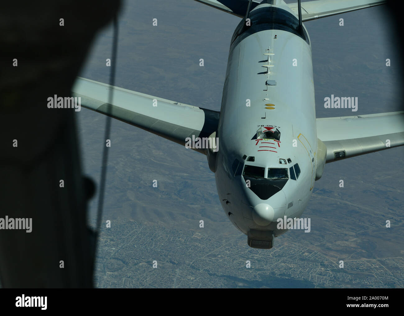 A U.S. Air Force E-3 Sentry (AWACS) prepares to connect with a KC-10 Extender, assigned to the 908th Expeditionary Air Refueling Squadron, out of Al Dhafra Air Base, United Arab Emirates, above an undisclosed location, Sept. 1, 2019. The 908th EARS, part of U.S. Air Forces Central Command, is responsible for delivering fuel to U.S. and coalition forces, enabling a constant presence in the area of responsibility. (U.S. Air Force photo by Staff Sgt. Chris Drzazgowski) Stock Photo