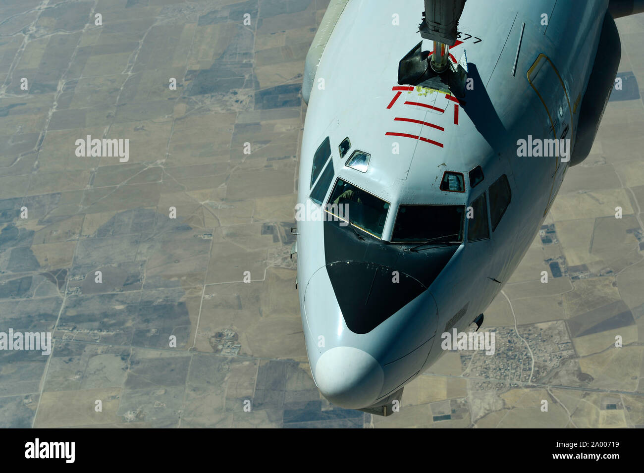 A U.S. Air Force E-3 Sentry (AWACS) receives fuel from a KC-10 Extender, assigned to the 908th Expeditionary Air Refueling Squadron, out of Al Dhafra Air Base, United Arab Emirates, above an undisclosed location, Sept. 1, 2019. The 908th EARS, part of U.S. Air Forces Central Command, is responsible for delivering fuel to U.S. and coalition forces, enabling a constant presence in the area of responsibility. (U.S. Air Force photo by Staff Sgt. Chris Drzazgowski) Stock Photo