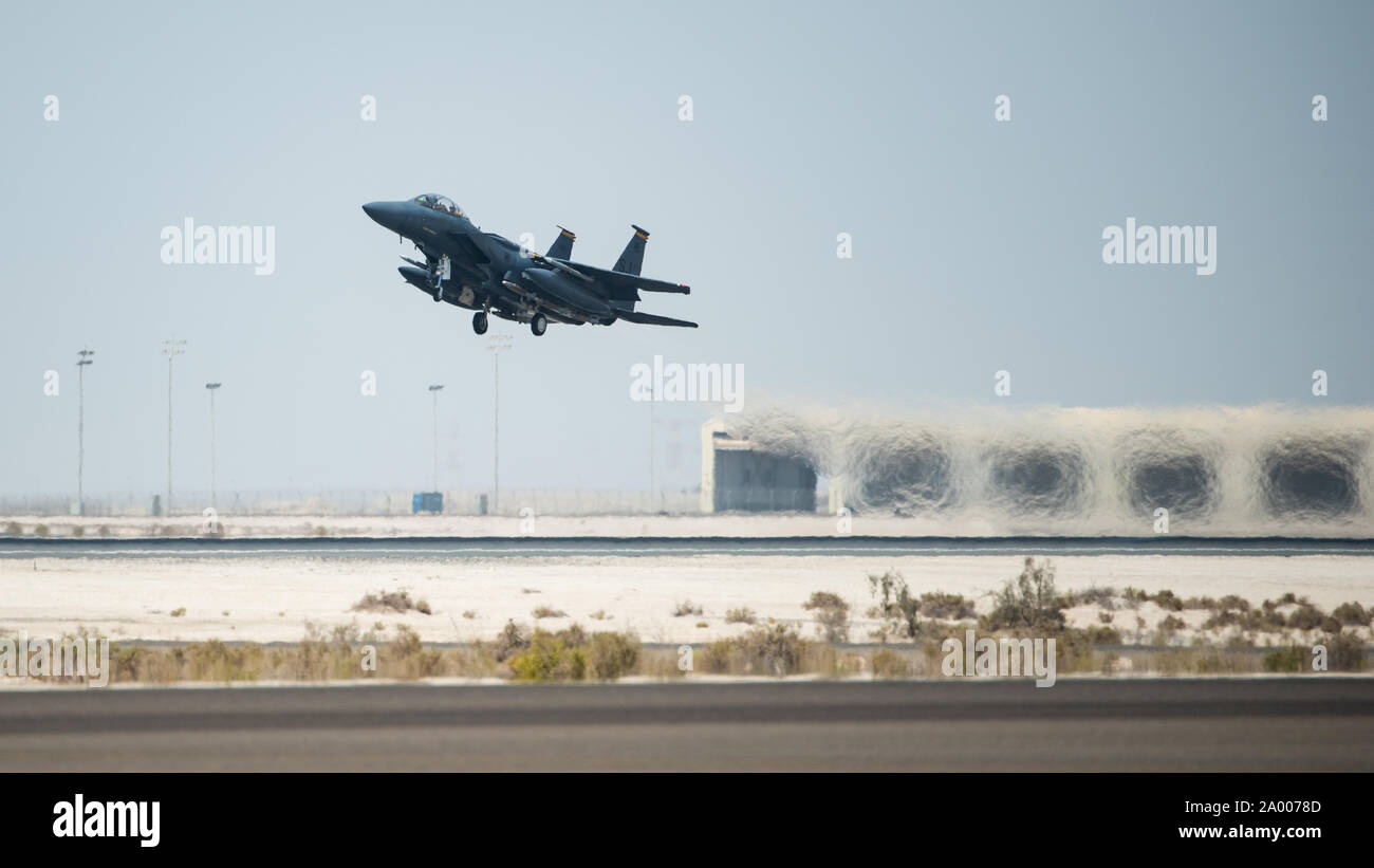 An F-15E Strike Eagle, assigned to the 336th Expeditionary Fighter Squadron, takes off for Agile Strike Sept. 18, 2019, at Al Dhafra Air Base, United Arab Emirates. The 336th EFS sent two aircraft and personnel to operate missions out of Prince Sultan Air Base, Saudi Arabia to challenge their flexibility at expanding tactical and strategic reach while strengthening coalition and regional partnerships in the Air Forces Central Command area of responsibility through adaptive basing. (U.S. Air Force photo by Staff Sgt. Chris Thornbury) Stock Photo