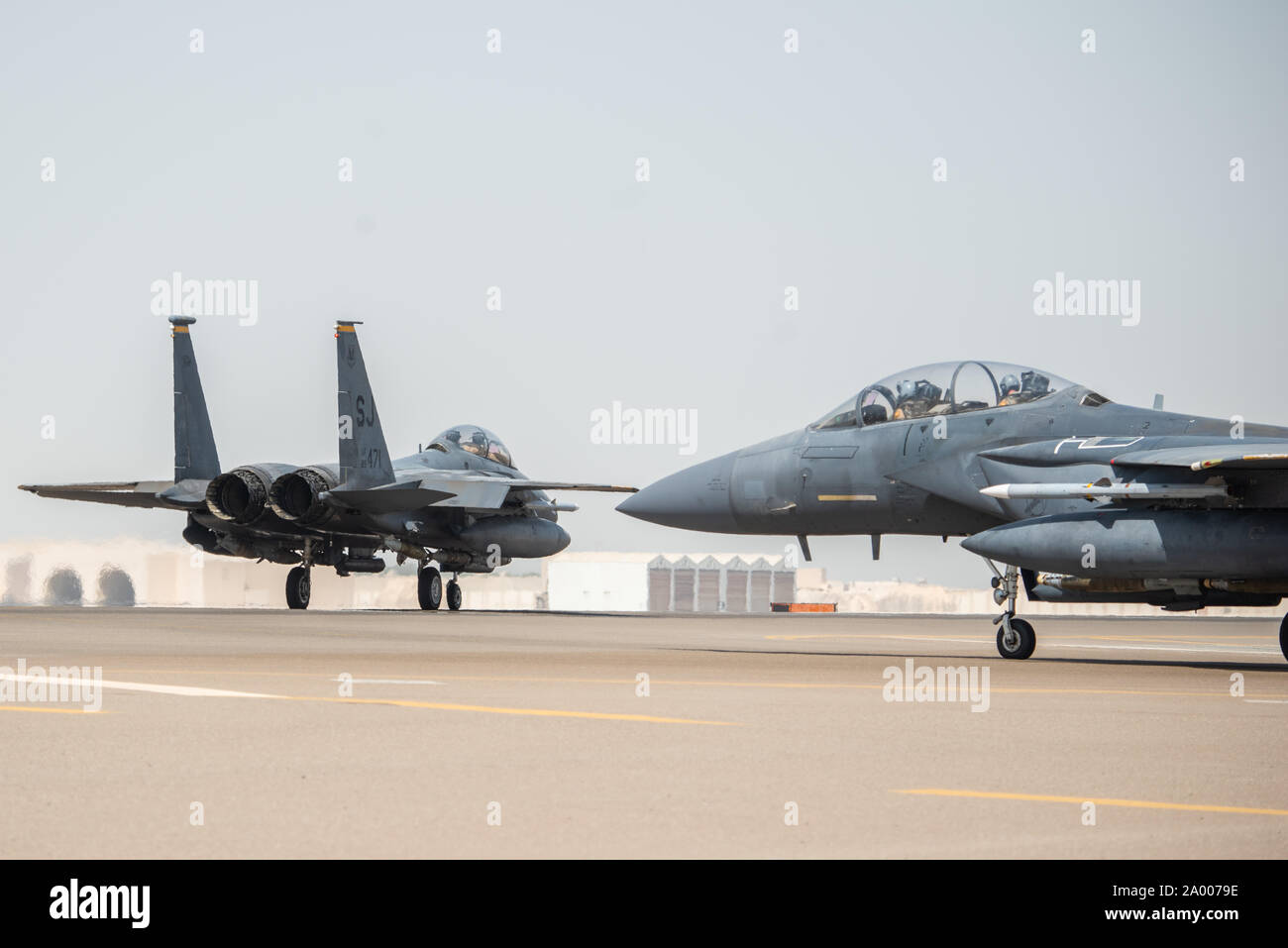 Two F-15E Strike Eagles, assigned to the 336th Expeditionary Fighter Squadron, taxi before flight for Agile Strike Sept. 18, 2019, at Al Dhafra Air Base, United Arab Emirates. The 336th EFS sent two aircraft and personnel to operate missions out of Prince Sultan Air Base, Saudi Arabia to challenge their flexibility at expanding tactical and strategic reach while strengthening coalition and regional partnerships in the Air Forces Central Command area of responsibility through adaptive basing. (U.S. Air Force photo by Staff Sgt. Chris Thornbury) Stock Photo