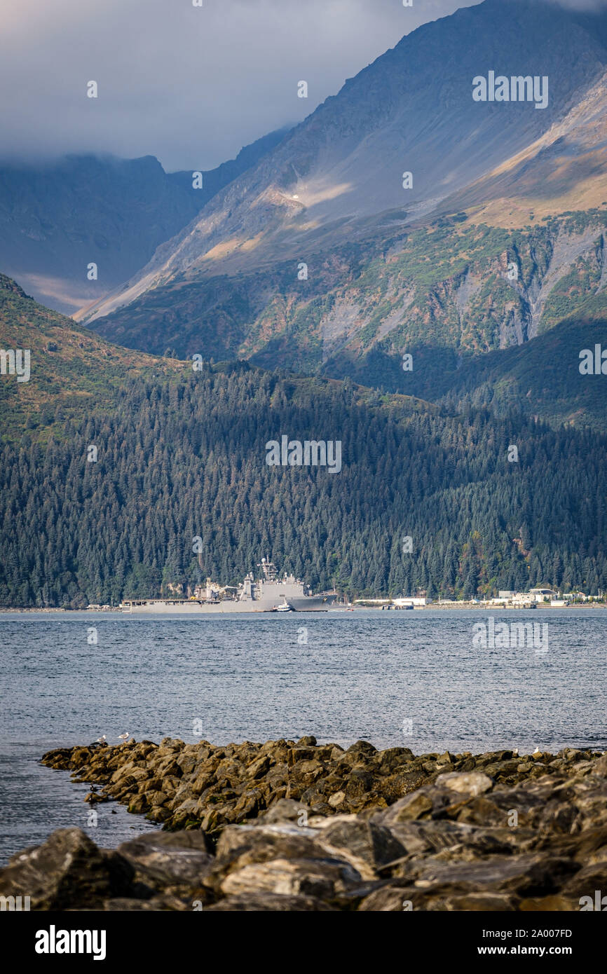 USS Comstock (LSD 45) pulls into Seward, Alaska during the Arctic Expeditionary Capabilities Exercise (AECE) 2019.  Approximately 3,000 U.S. Navy and Marine Corps personnel participate in AECE 2019, a joint training exercise that tests expeditionary logistical capabilities in the Arctic region and prepares joint forces to respond to crises across the Indo-Pacific. (Photo by Senior Chief Petty Officer Brandon Raile) Stock Photo