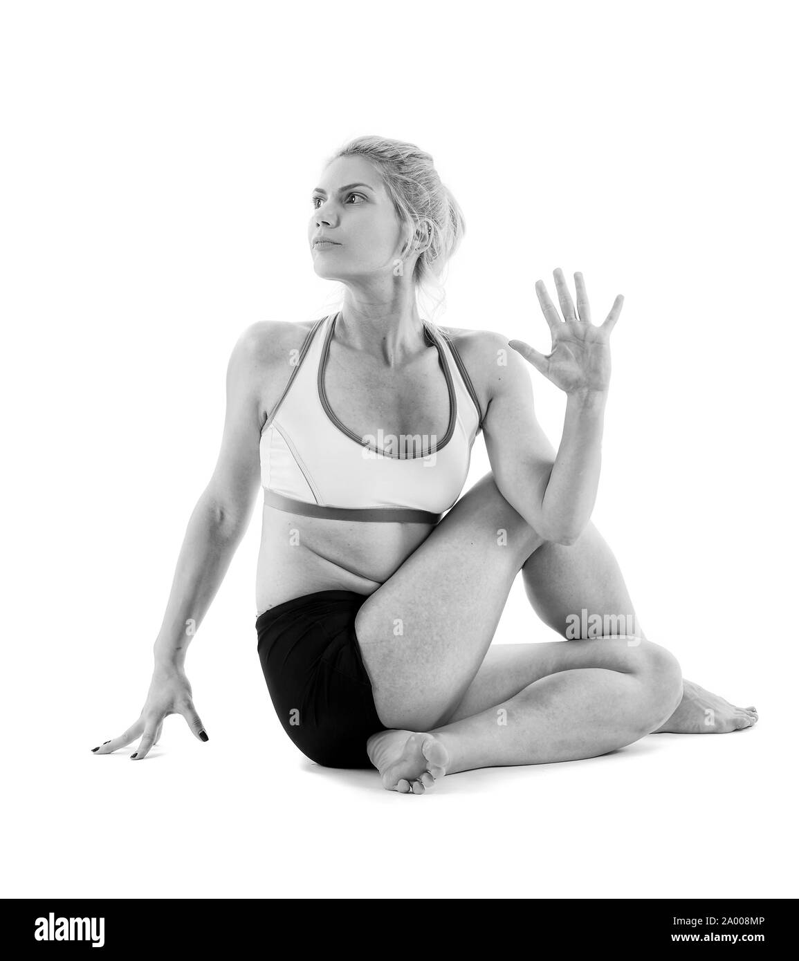 Woman yoga teacher in various poses (asana) isolated on white background Stock Photo