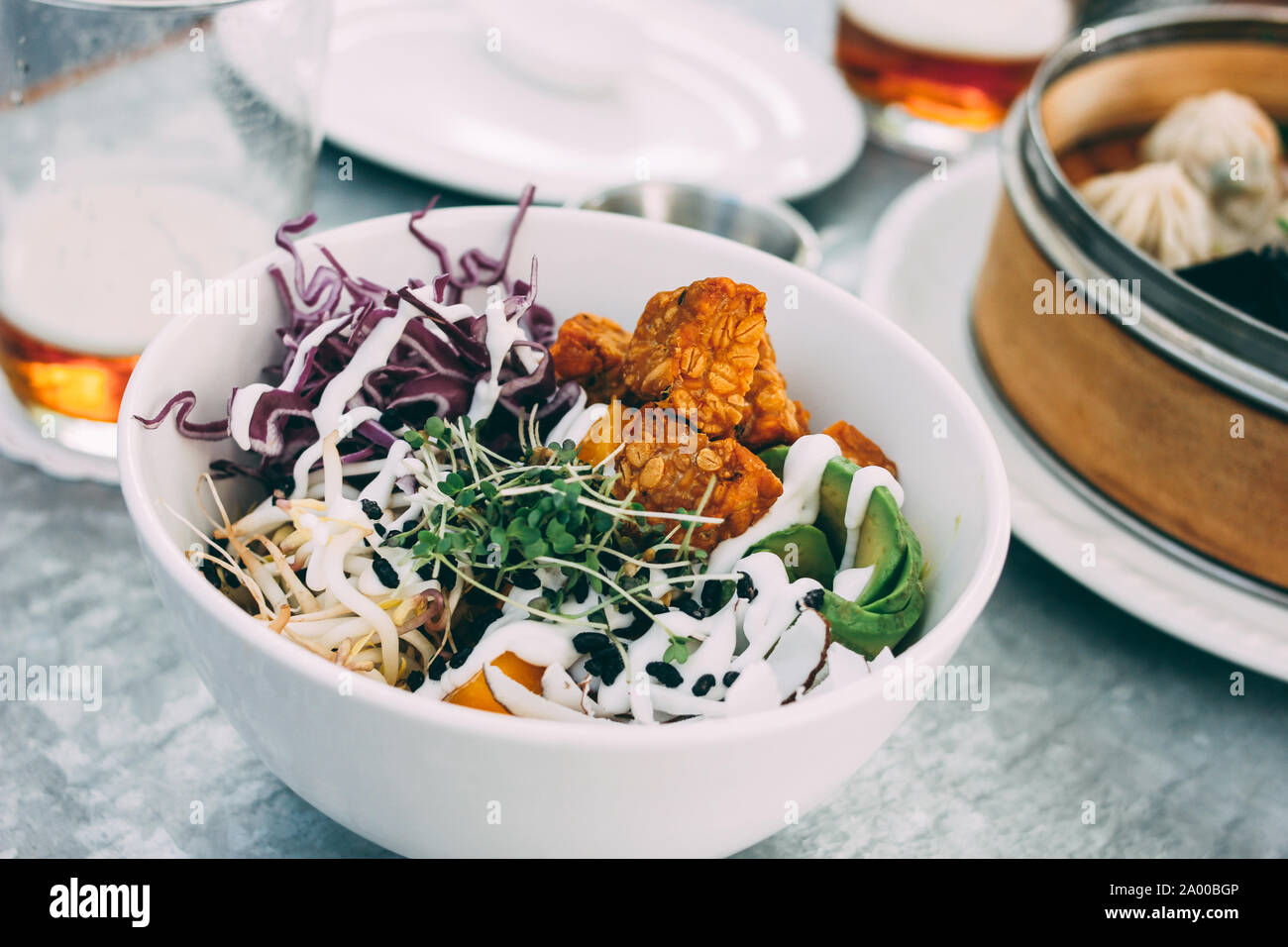 PanAsian food the vegetable salad bowl and different dim sums. Lunch